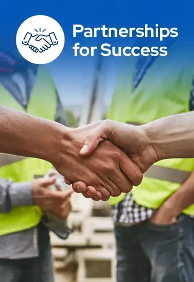Professionals shaking hands at a job site, representing strong partnerships, collaboration, and customer success in municipal equipment and service operations.