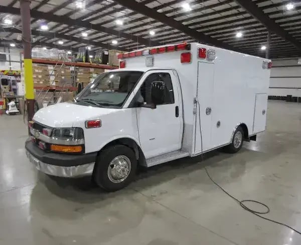Braun Express Type III ambulance with a van chassis, modular patient compartment, and emergency lighting for medical transport.