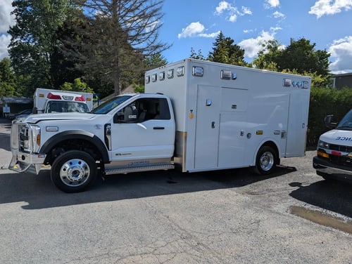Drivers side shot of In-Stock Demers MXP170E Ambulance