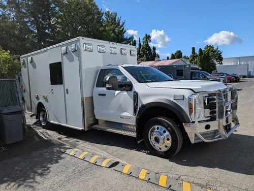Passenger side view of Demers MXP170E In-Stock Ambulance