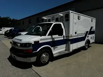 Completed EMS ambulance remount combining an existing patient module with a replacement chassis for continued frontline service.