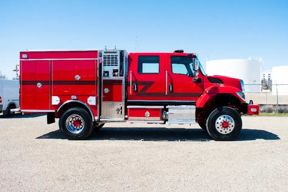 BME Type 3 Cal Fire engine with a crew cab, side equipment compartments, emergency lighting, and a wildland firefighting body.