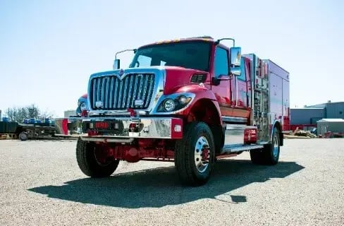 BME Type 3 Targhee fire engine with a utility body, crew cab, off-road tires, and emergency lighting.