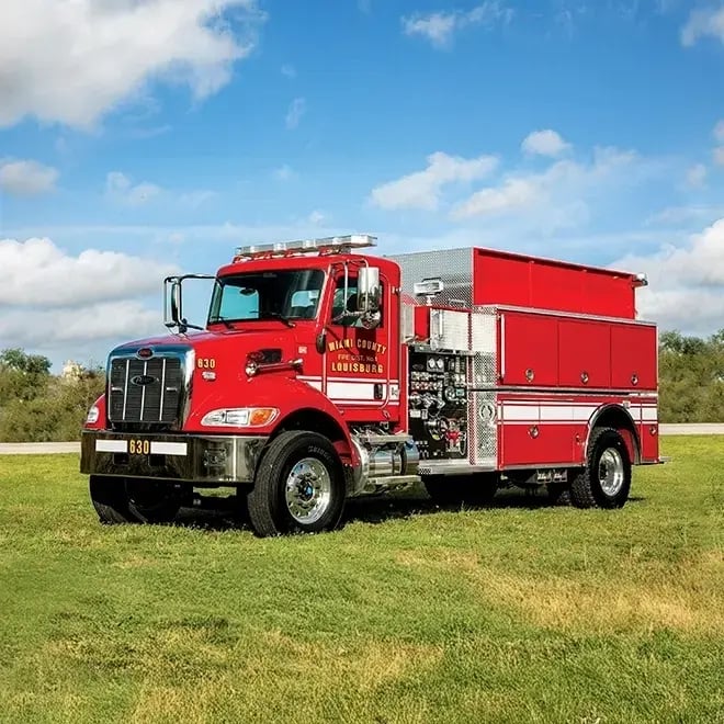 Right-side view of a Pierce fire apparatus built on a commercial chassis with equipment compartments and a crew cab.
