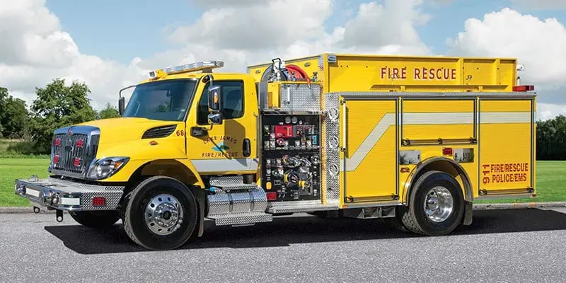 Pierce fire apparatus built on an International commercial chassis with a crew cab and exterior equipment compartments.