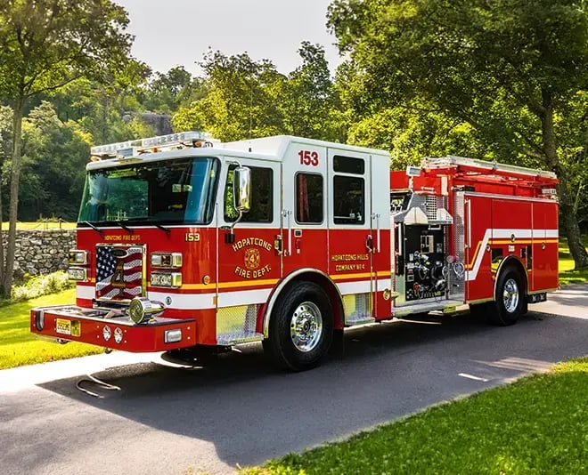 Pierce Saber fire apparatus built on a custom chassis with a crew cab, equipment compartments, and emergency warning lights.