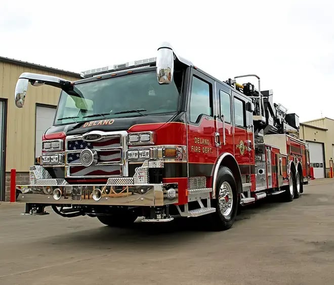 Pierce fire apparatus built on a custom chassis with a crew cab, aerial device, and emergency response equipment.
