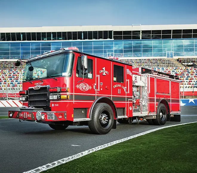 Right-side view of a Pierce pumper apparatus with pump controls, equipment compartments, and emergency response equipment.