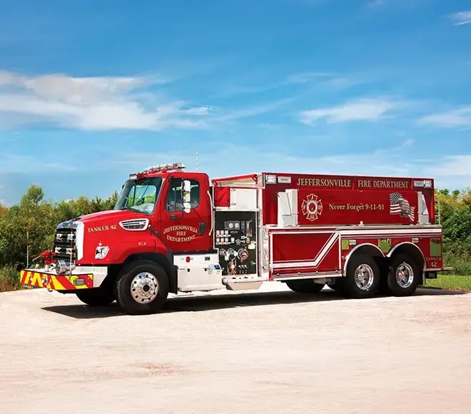 Pierce fire apparatus built on a Freightliner commercial chassis with a crew cab and exterior equipment compartments.