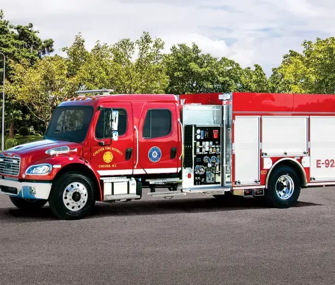 Pierce commercial pumper fire engine with a commercial truck chassis, pump panel, and exterior equipment compartments.