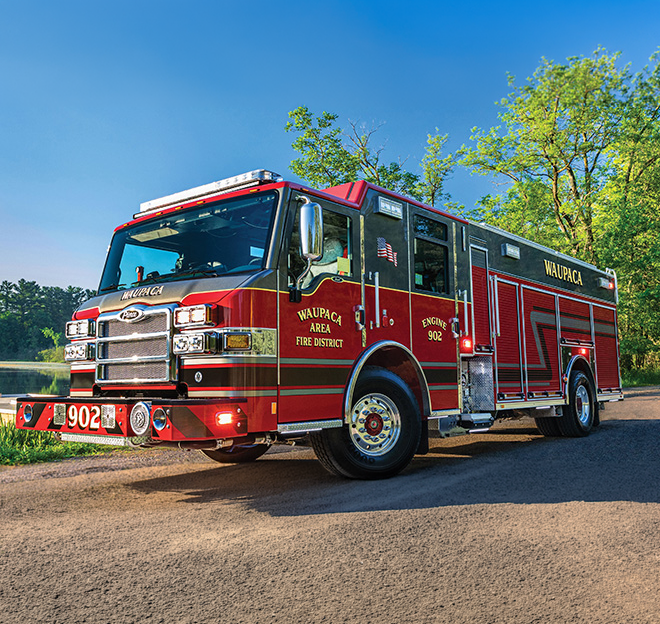 Pierce Impel fire apparatus built on a custom chassis with a crew cab, equipment compartments, and emergency warning lights.