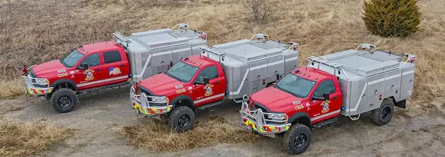 Three Skeeter brush trucks equipped for wildland firefighting and off-road emergency response.