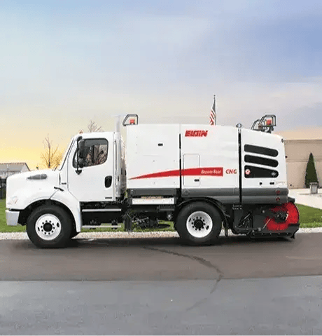 Elgin Broom Bear mechanical sweeper designed for efficient street cleaning, debris collection, and municipal maintenance.