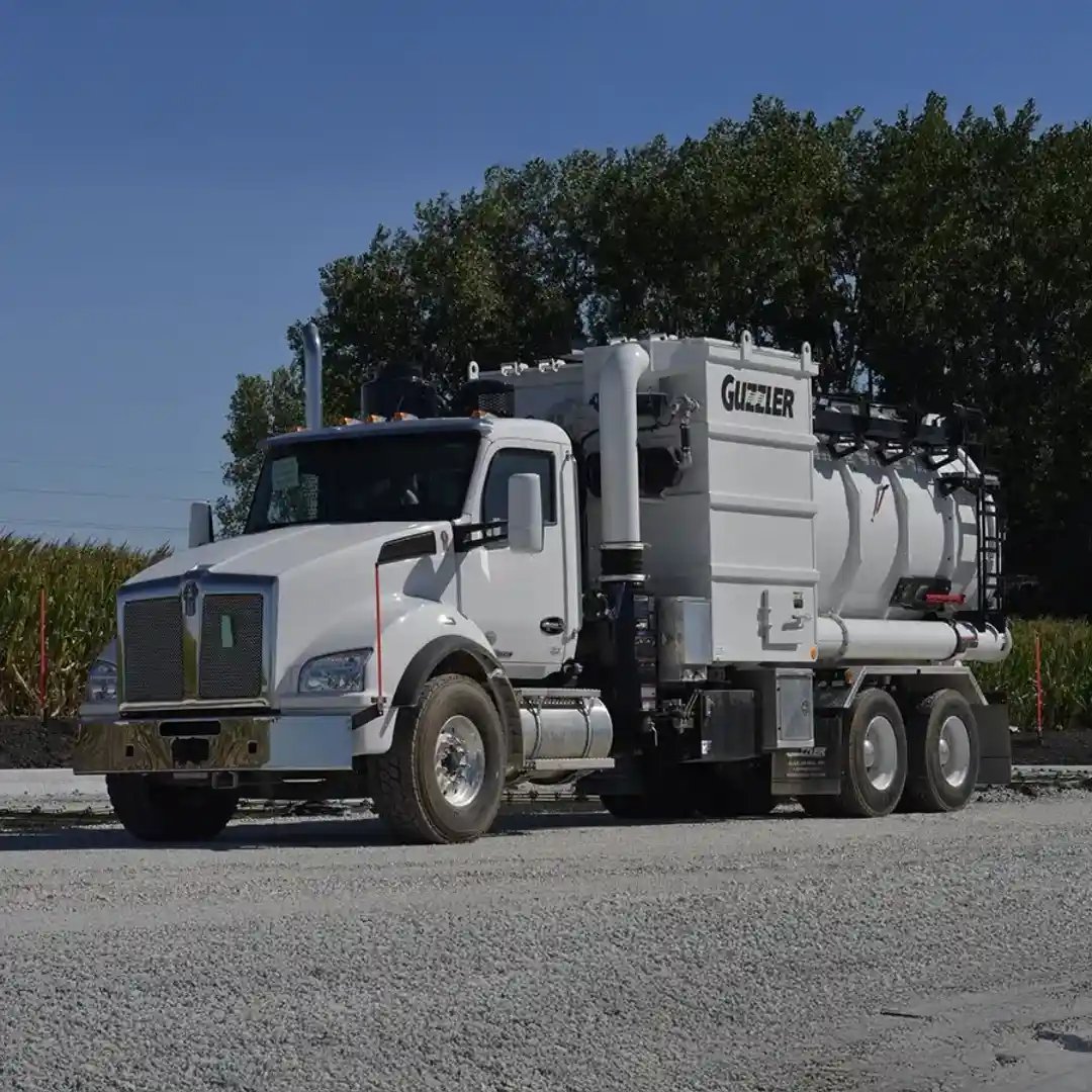 Guzzler Classic industrial vacuum truck positioned outdoors, featuring a high-capacity vacuum system and debris tank for industrial cleaning, excavation, and material recovery.