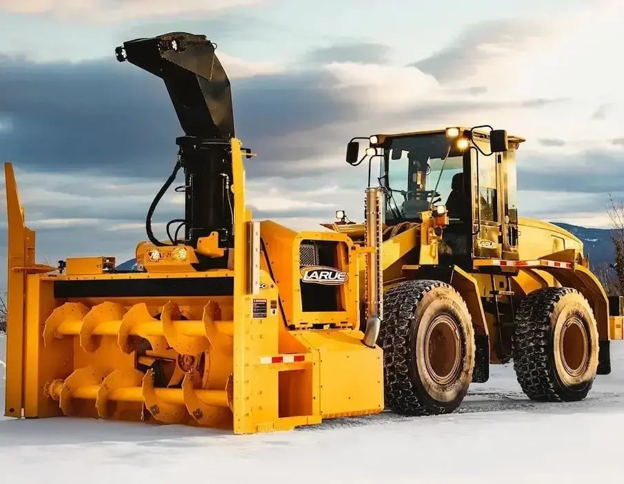 Larue D50 snowblower positioned outdoors, featuring a high-capacity snow removal system designed for efficient clearing of runways, roadways, and large paved areas.