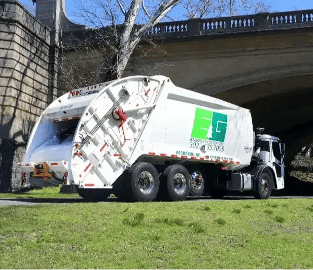 McNeilus Extra Compaction rear loader refuse truck engineered for high-density waste collection, increased payload capacity, and efficient municipal sanitation operations.
