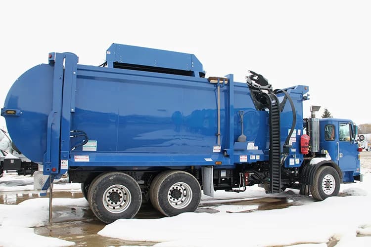 Autocar refuse truck equipped with a McNeilus ZR automated collection system for municipal sanitation fleets.