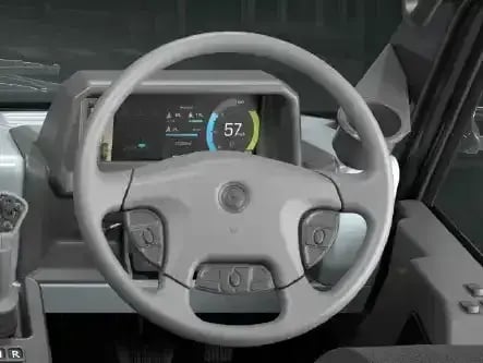 Electric refuse truck driver station featuring a digital instrument display, ergonomic steering wheel controls, and advanced vehicle monitoring technology.