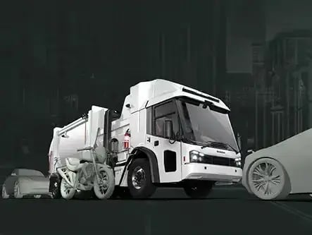 Electric refuse truck featuring advanced pedestrian safety technology, enhanced visibility, and a low-entry cab design for urban waste collection operations.