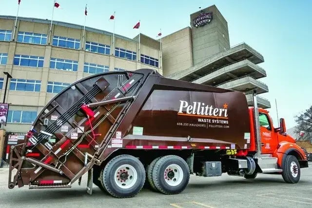 McNeilus rear-loader refuse truck operated by Pellitteri Waste Systems, providing reliable commercial and municipal waste collection services.