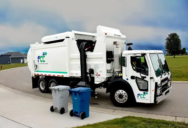 McNeilus ZR side loader with automated collection arm mounted on a Mack chassis.
