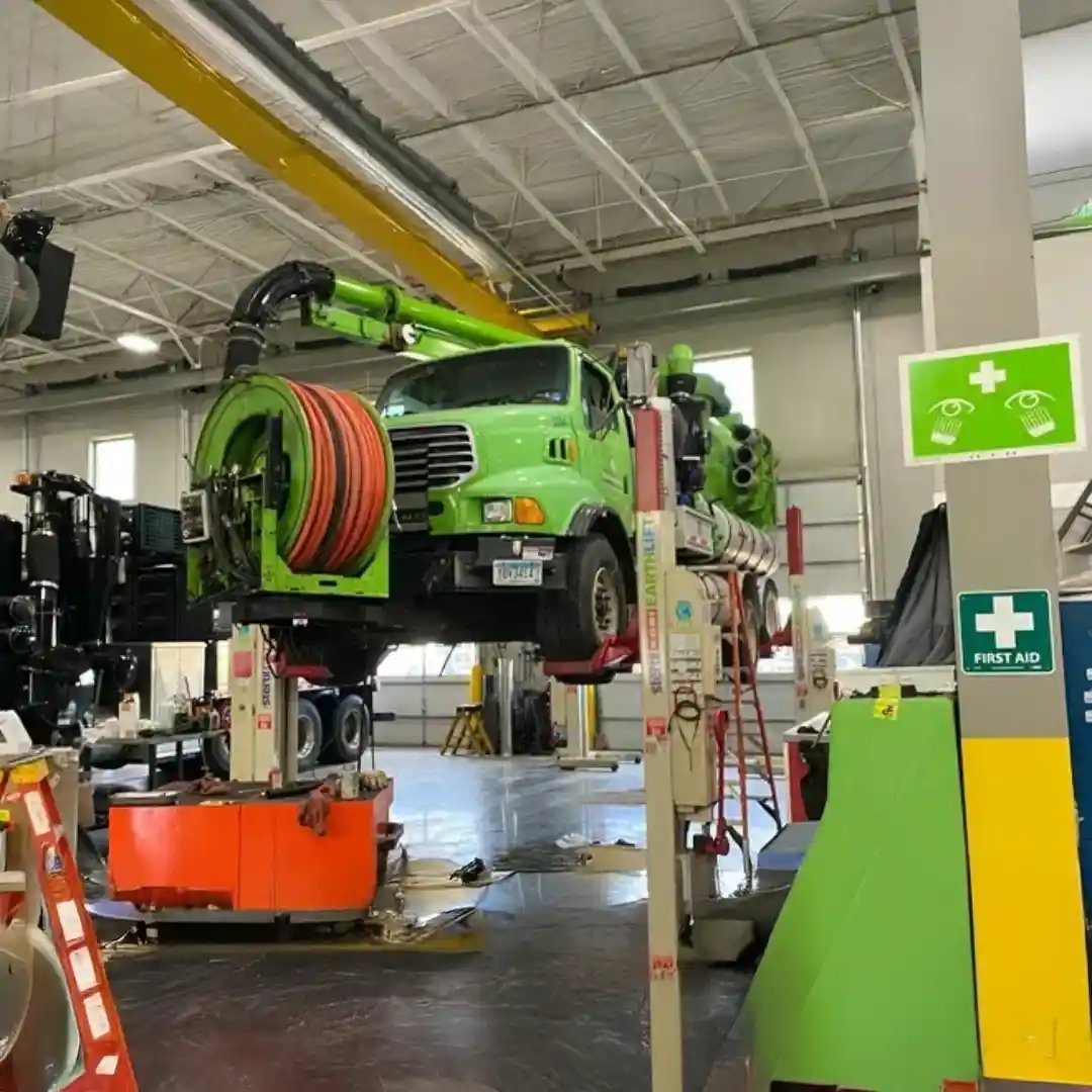 Equipment undergoing service in a maintenance shop, positioned for inspection, repairs, and routine upkeep to support reliable operational performance.