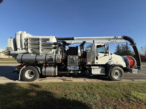 Passenger side photo of a 2027 MacQueen Stock Vactor 2100i
