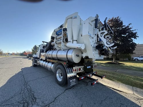 Rear driver side angle of a MacQueen stock 2027 Vactor 2100i