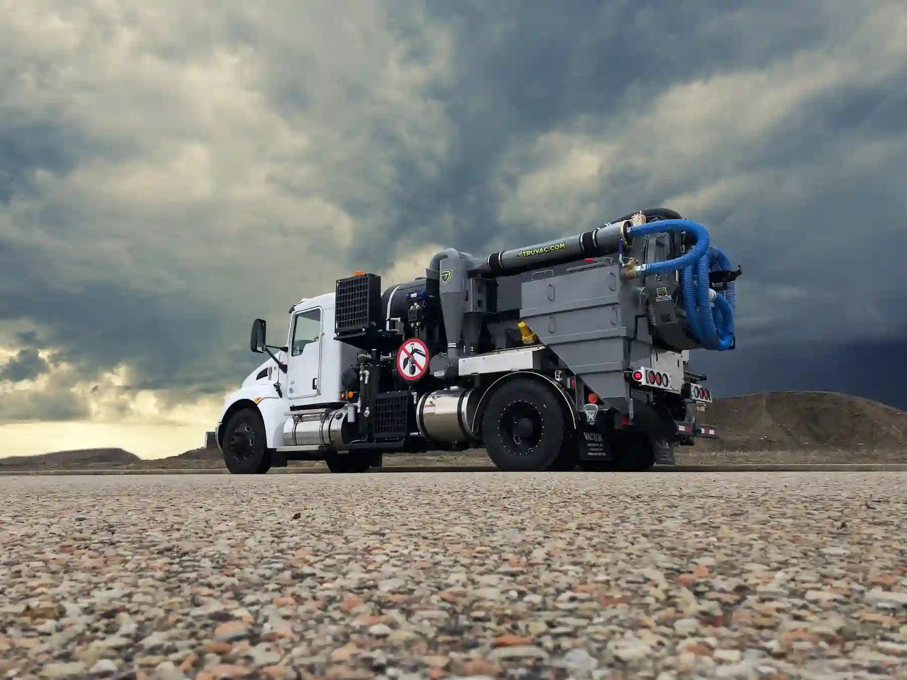 TRUVAC Paradigm unit displayed outdoors, highlighting its streamlined equipment layout, hose management system, and high-capacity debris containment design.