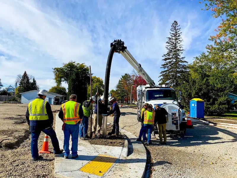 Field training session featuring professionals operating a TRUVAC hydro excavation truck outdoors, demonstrating safe excavation practices, utility locating, and equipment operation.