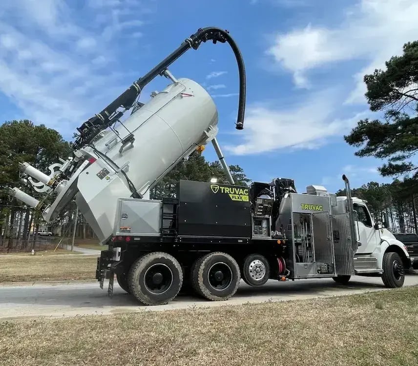 TRUVAC FLXX hydro excavator with debris body raised for efficient dumping, supporting vacuum excavation, utility daylighting, and non-destructive digging operations.