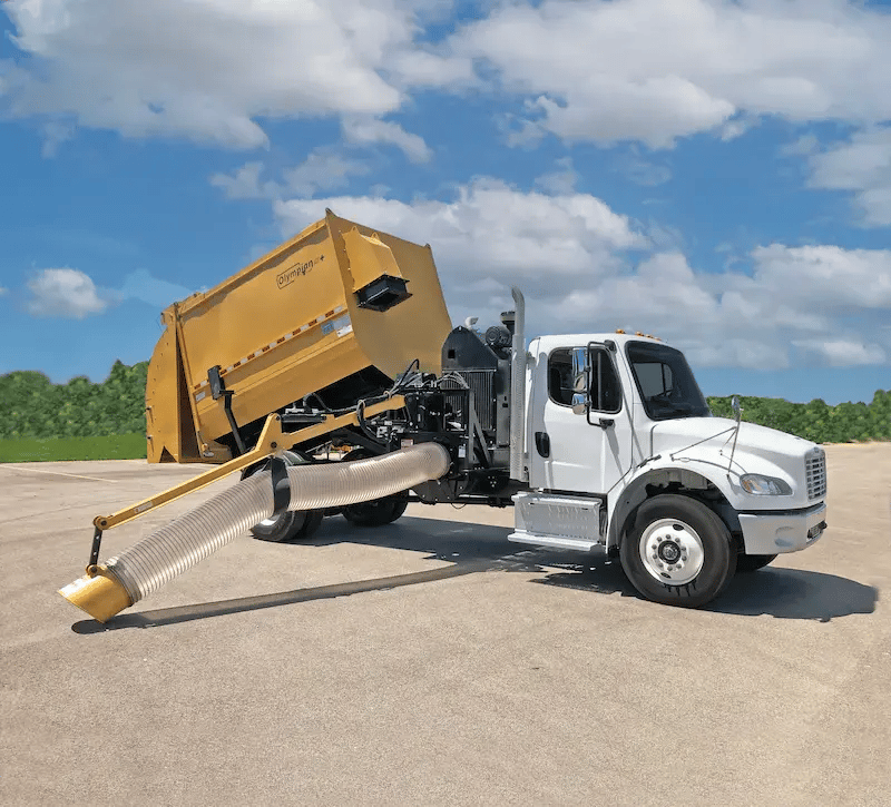 Titan Olympian leaf collection truck equipped with a high-capacity vacuum system for municipal leaf pickup and seasonal debris removal.
