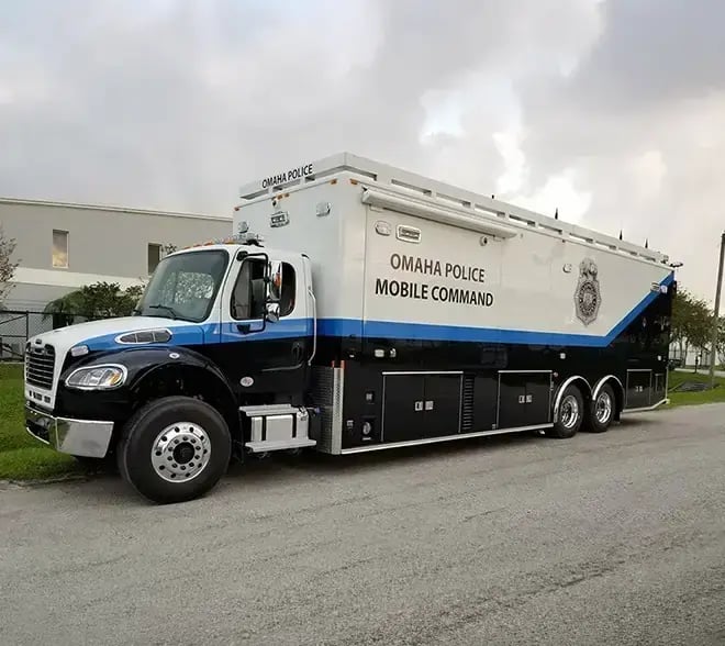 Large police mobile command vehicle equipped for incident management, communications, and field operations support.