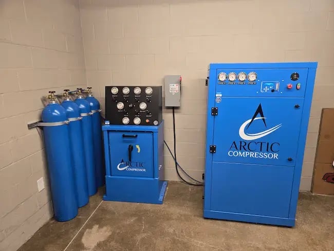 Arctic Compressor breathing air compressor system for SCBA cylinder filling and fire department operations.