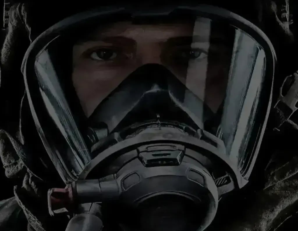Firefighter wearing an MSA SCBA facepiece designed for respiratory protection in hazardous emergency environments.