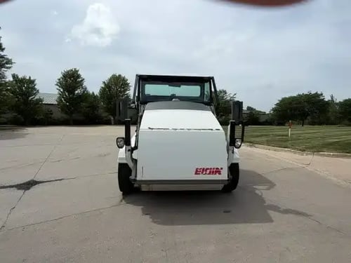 Front view of a 2018 Elgin Pelican NP street sweeper.