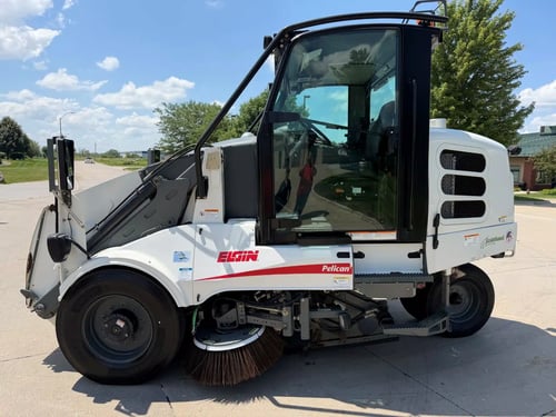 2015 Elgin Pelican NP street sweeper driver side profile.