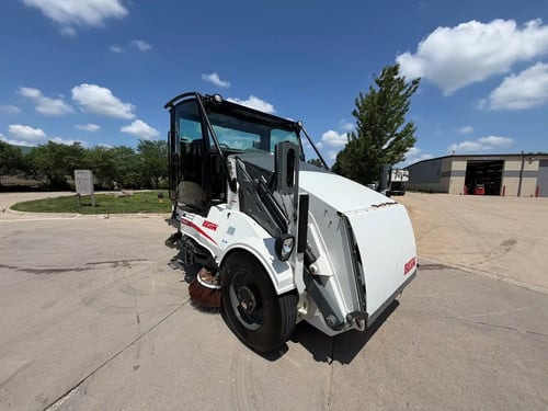 2015 Elgin Pelican NP street sweeper rear view showing EcoInfused technology and safety markings