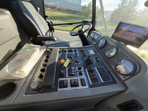 Operator control console inside a 2016 Elgin Pelican NP street sweeper.
