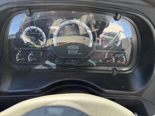 Instrument cluster and odometer of a 2013 Elgin Whirlwind street sweeper showing approximately 38,154 miles.