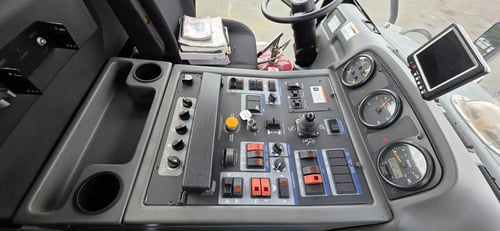 Operator control panel inside a 2015 Elgin Pelican NP Dual street sweeper.