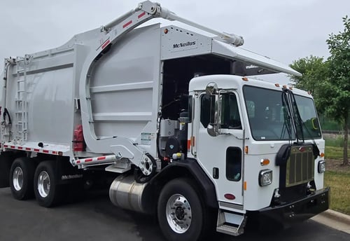 2026 McNeilus Atlantic Commercial 40 yard front loader garbage truck front passenger side view