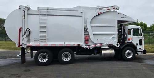 2026 McNeilus Atlantic Commercial 40 yard front loader refuse truck passenger side profile