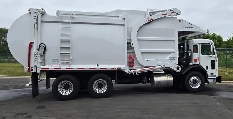 2026 McNeilus Atlantic Commercial 40 yard front loader refuse truck passenger side profile