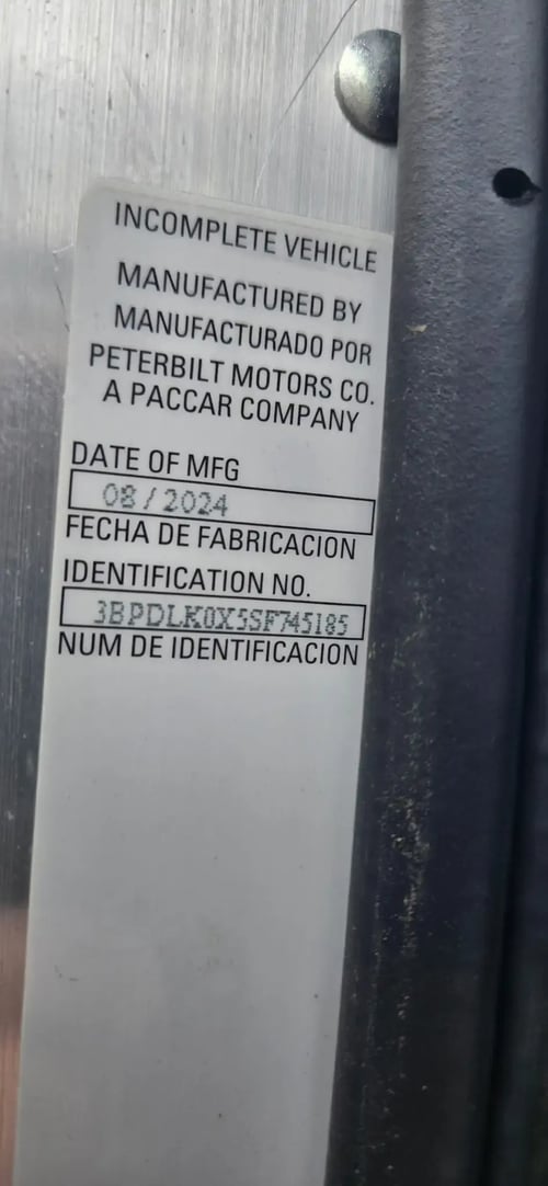 Peterbilt chassis certification label on 2026 McNeilus Atlantic Commercial refuse truck
