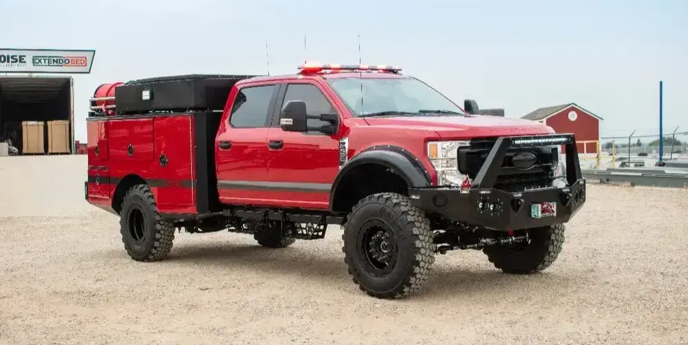 BME Type 6 fire rescue truck with a utility body, off-road tires, warning lights, and front bumper protection.