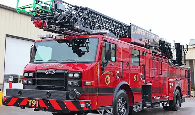 Pierce aerial ladder apparatus with an elevated ladder system, emergency response equipment, and firefighter access features designed for rescue and fire suppression operations.