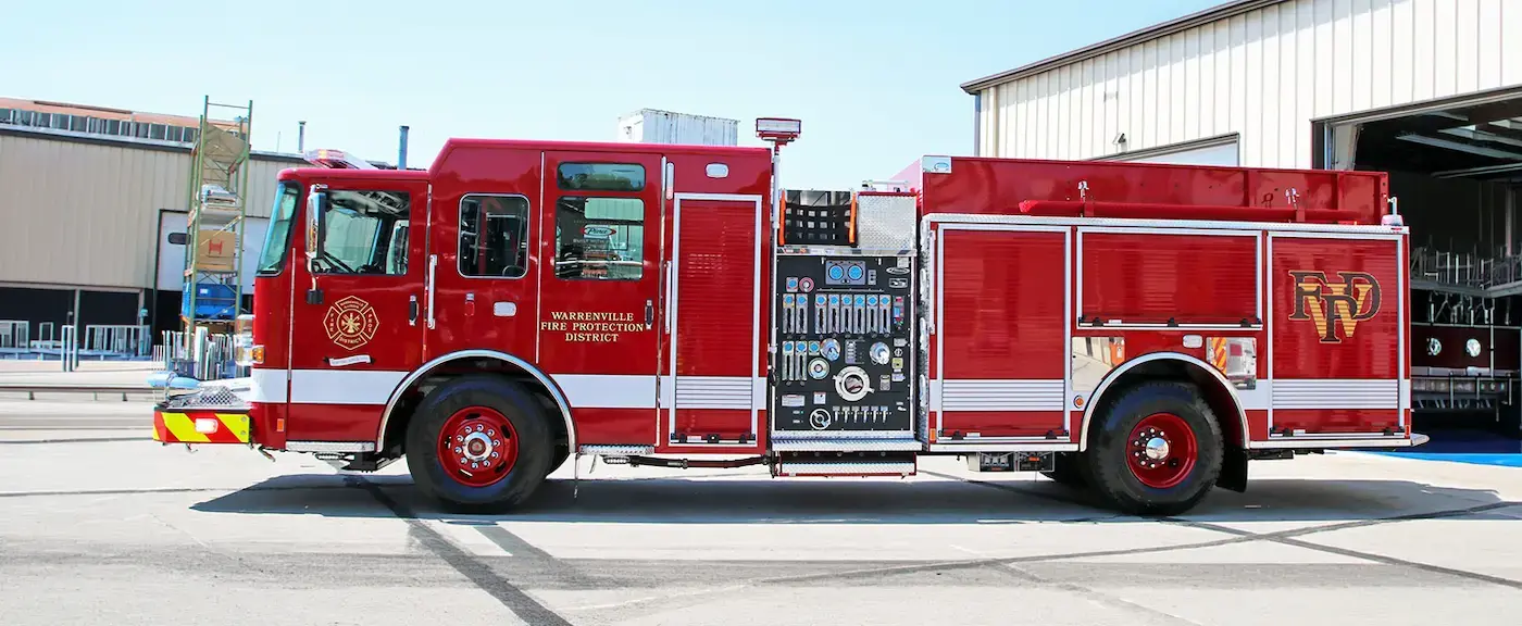 Pierce rescue pumper shown from the right side with firefighting equipment compartments, pump controls, and emergency lighting.