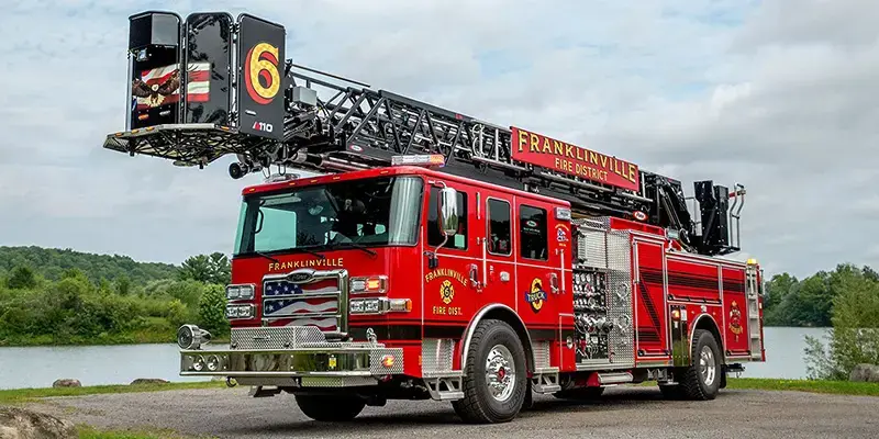 Pierce aerial platform fire truck equipped with an elevated platform, aerial device, and firefighting equipment.