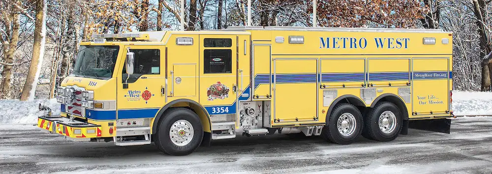 Right-side view of a Pierce tanker truck with a large water tank body, equipment compartments, and emergency warning lights.